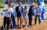 Attendees taking part in ground breaking