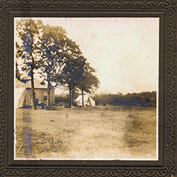 Man outside house and Girls outside tent, unknown donor