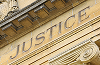 Justice etched in Stone on Building