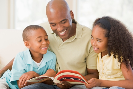 Dad reading with kids