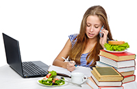 young woman at computer studying