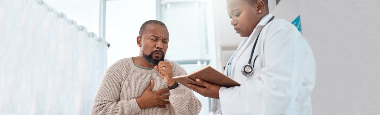 African American Male Speaking with Doctor