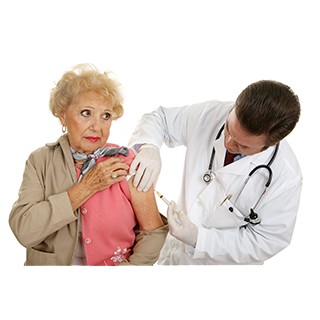 older white woman receiving flu shot