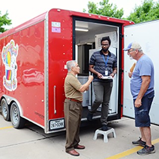 Food inspectors on the job, speaking to mobile food vendor