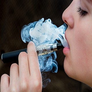 young woman vaping