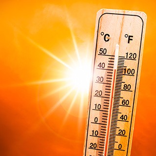 sun with thermometer reading high temperatures