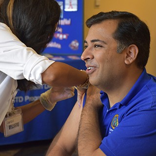 Public Health Director Vinny Taneja getting flu shot