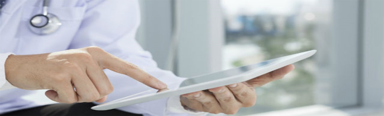 Medical professional working on her tablet